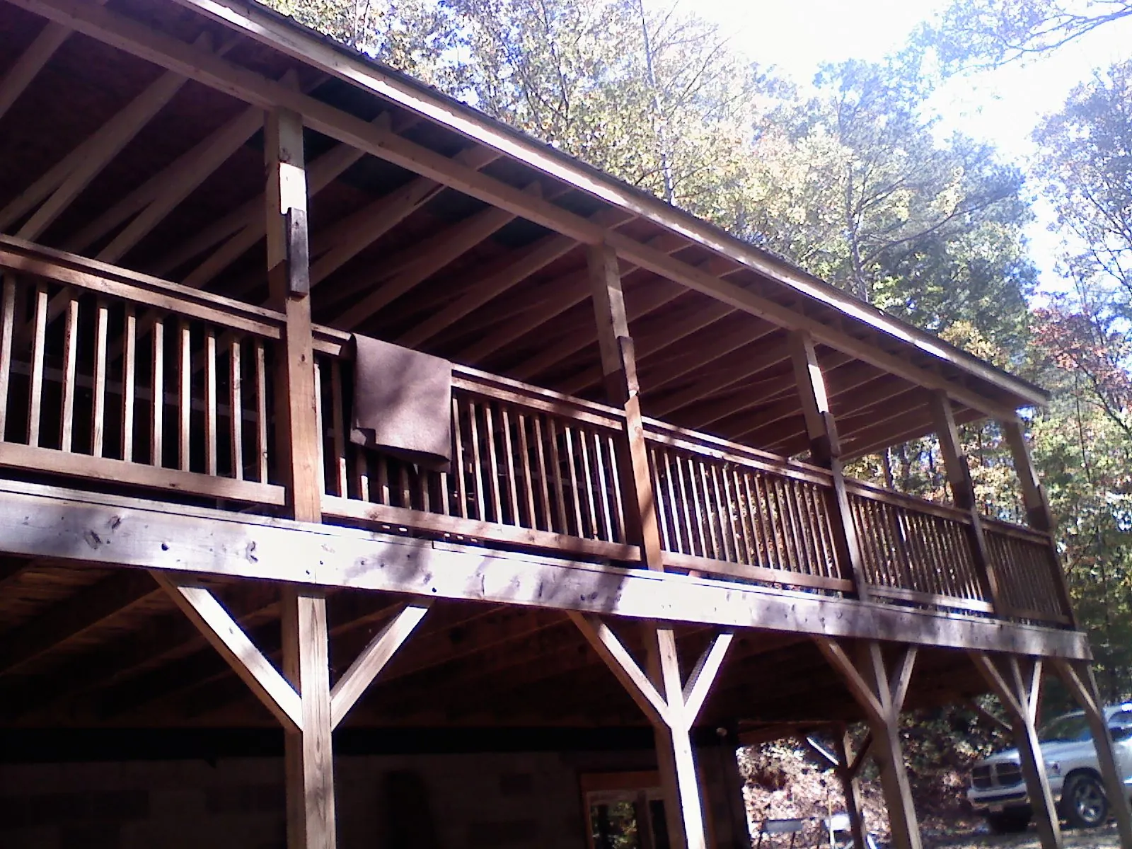 Timber framing under a new elevated porch and deck — Roof Leak Repair in Genesee by Roofing Brothers